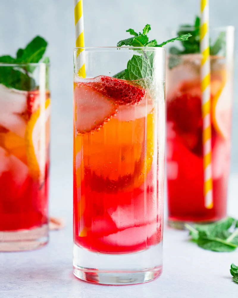 Three glasses filled with Vodka Spritzer in a table.